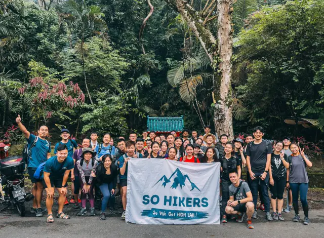 Group at bamboo forest viewpoint with So Hikers flag