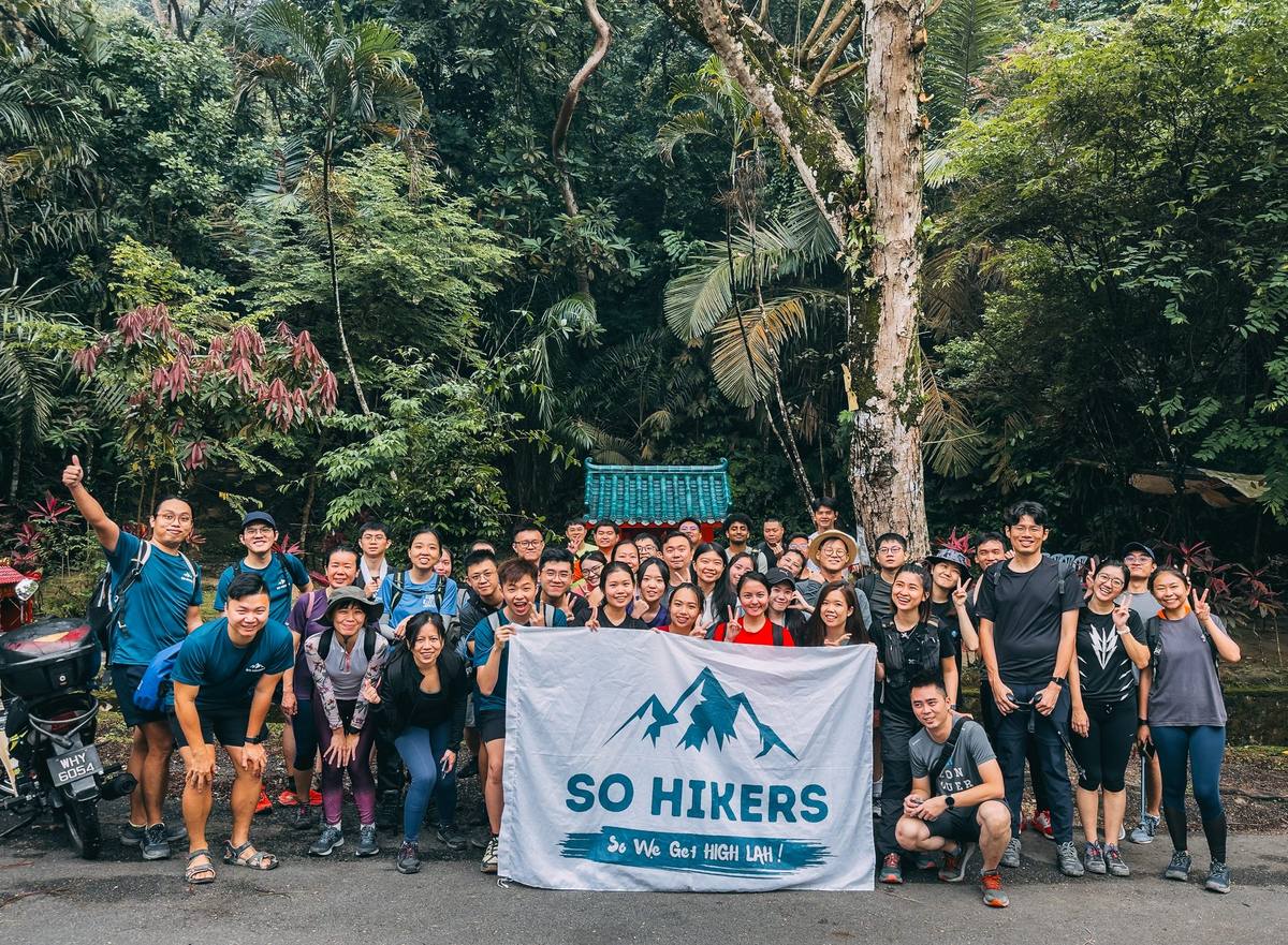 Group at bamboo forest viewpoint with So Hikers flag