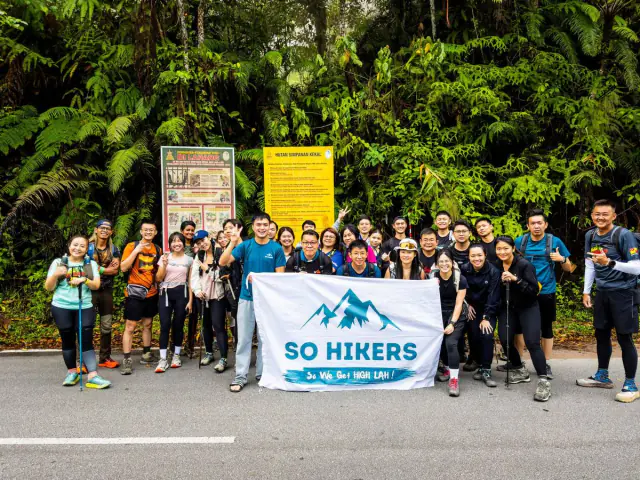Group at volcanic crater rim with stunning landscape