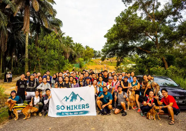 Group at forest reserve signboard trailhead