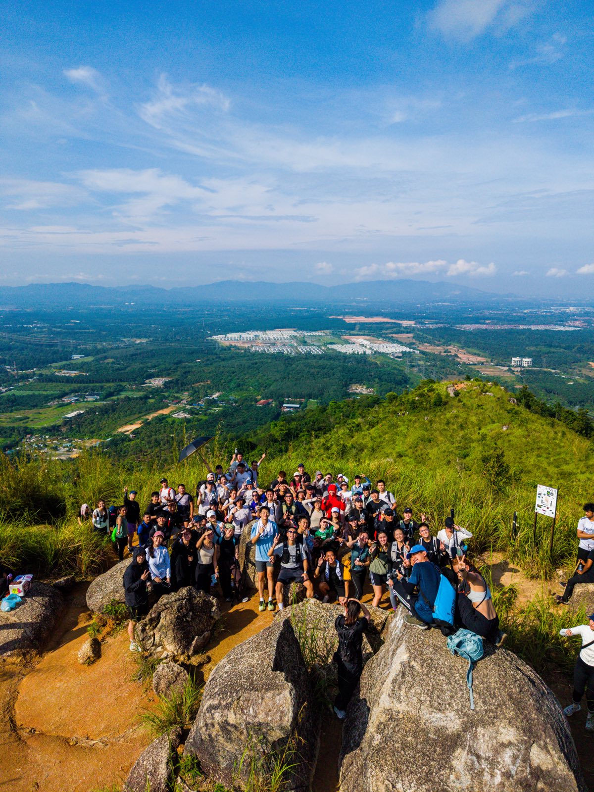 So Hikers group at a rocky summit overlooking the valley