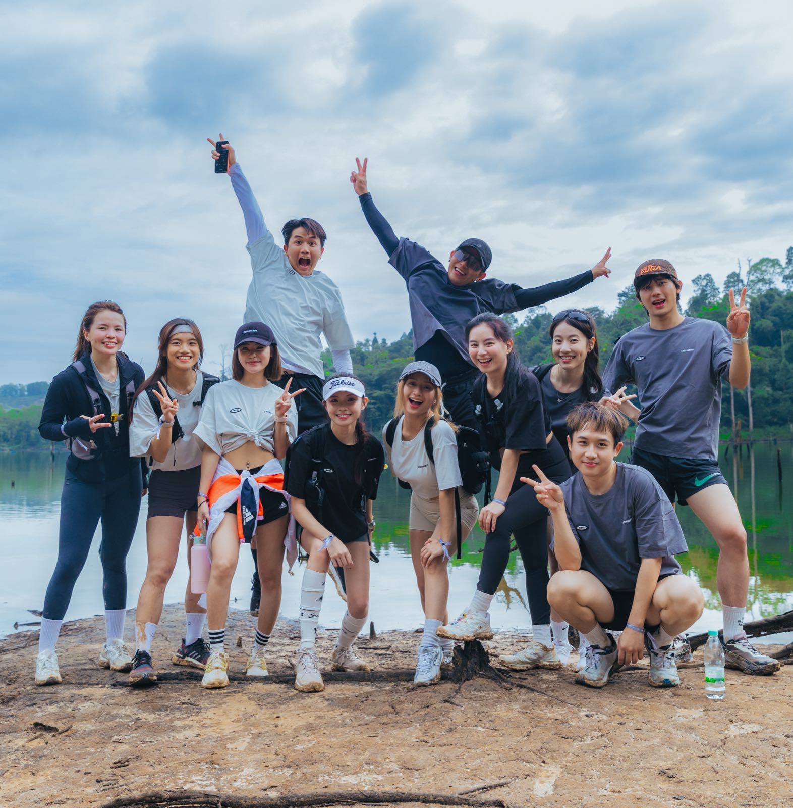 So Hikers x STEP8IGHT hikers celebrating by the lake at Bukit Berekeh