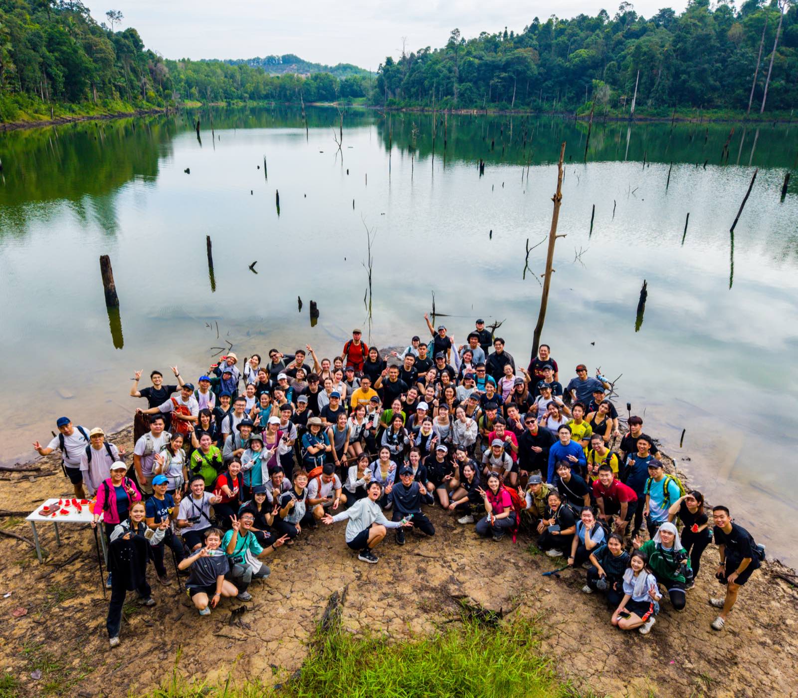 Aerial drone shot of the whole So Hikers group beside the lake
